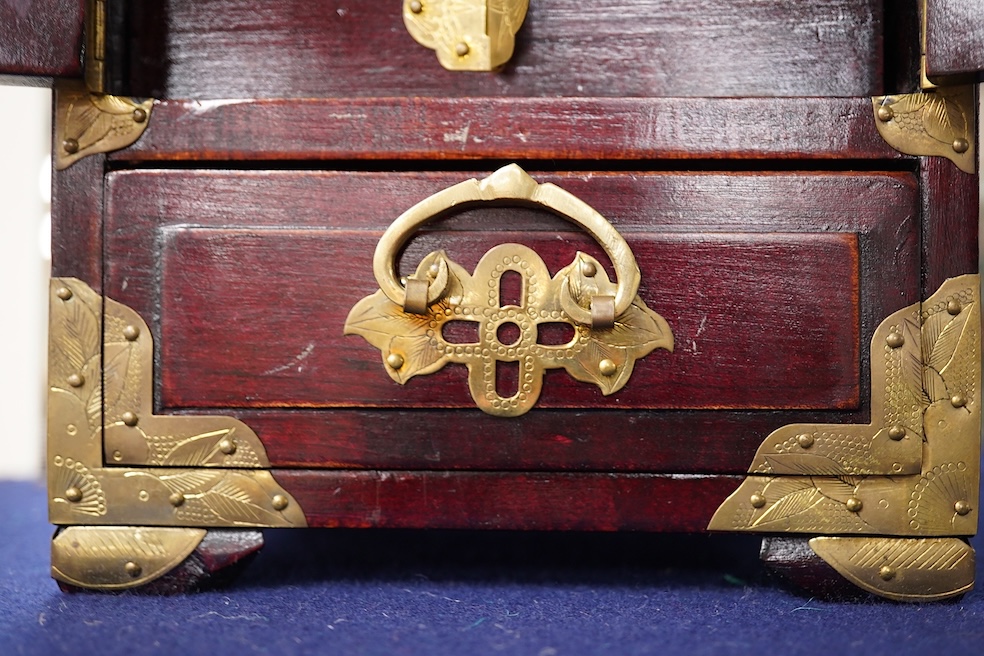 A Chinese brass mounted jewellery cabinet, decorated with enamel plaques. 21cm high. Condition - generally good